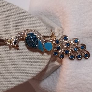 Betsy Johnson gold toned necklace, peacock